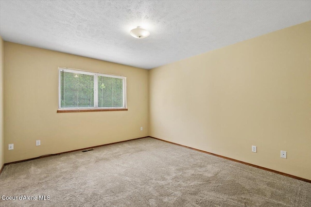 879 E Cloverleaf Dr, Hayden, ID 83835 - unfurnished room featuring carpet floors and a textured ceiling