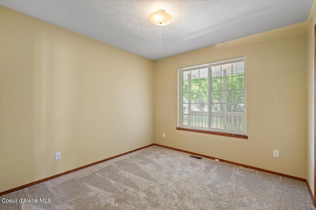 879 E Cloverleaf Dr, Hayden, ID 83835 - unfurnished room with carpet and baseboards