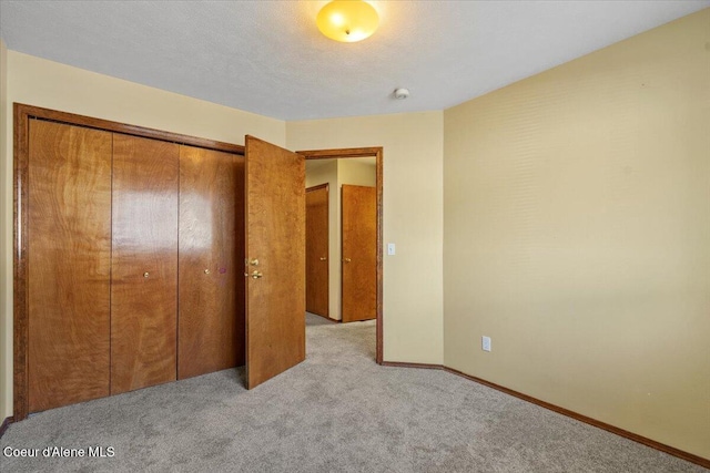 879 E Cloverleaf Dr, Hayden, ID 83835 - unfurnished bedroom with carpet floors and a closet