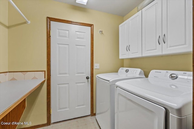 879 E Cloverleaf Dr, Hayden, ID 83835 - laundry room with cabinet space and washer and clothes dryer