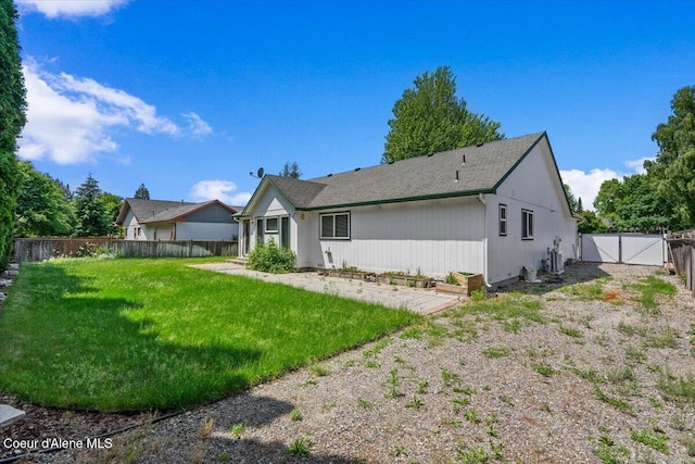 879 E Cloverleaf Dr, Hayden, ID 83835 - back of house featuring a gate and a fenced backyard