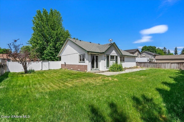 879 E Cloverleaf Dr, Hayden, ID 83835 - back of property featuring a fenced backyard and brick siding