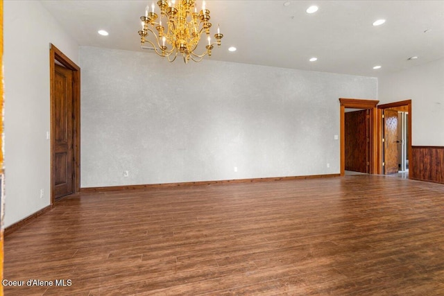 5239 E Dodd Rd, Hayden, ID 83835 - empty room featuring wood finished floors, a chandelier, and recessed lighting