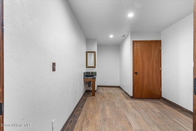 5239 E Dodd Rd, Hayden, ID 83835 - hallway featuring wood finished floors and recessed lighting