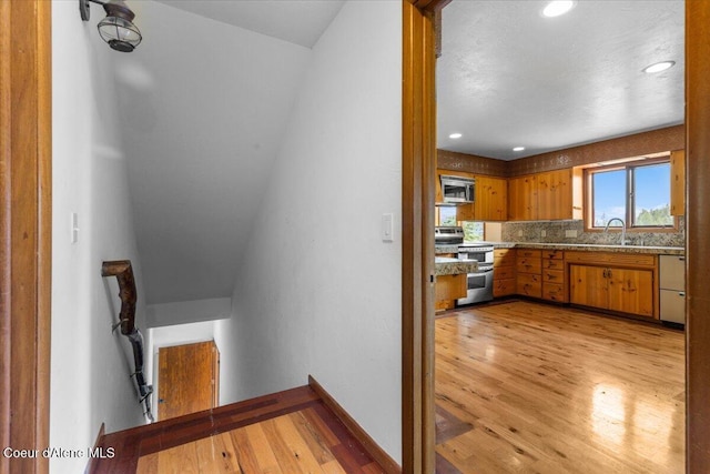 5239 E Dodd Rd, Hayden, ID 83835 - stairs with wood finished floors and recessed lighting