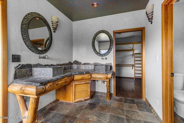 5239 E Dodd Rd, Hayden, ID 83835 - bathroom featuring stone tile floors and toilet