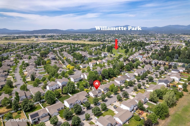 1817 N Chehalis St, Post Falls, ID 83854 - aerial view of property's location with a mountainous background and nearby suburban area
