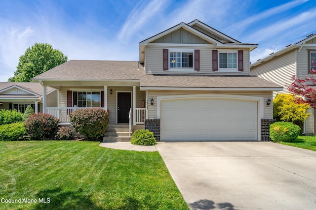 1817 N Chehalis St, Post Falls, ID 83854 - view of front of home featuring an attached garage, a front yard, board and batten siding, driveway, and brick siding
