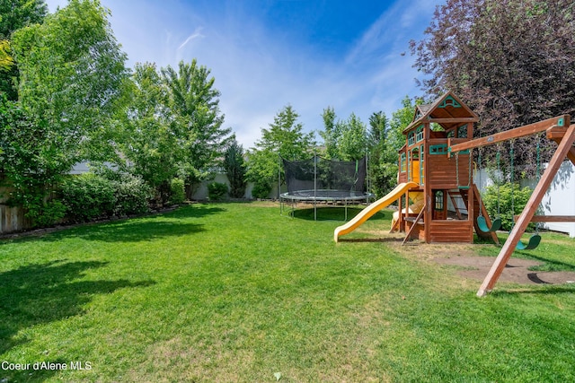 1817 N Chehalis St, Post Falls, ID 83854 - fenced backyard with a trampoline and a playground
