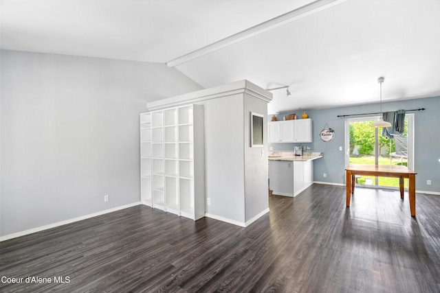 1817 N Chehalis St, Post Falls, ID 83854 - unfurnished living room with dark wood finished floors and baseboards