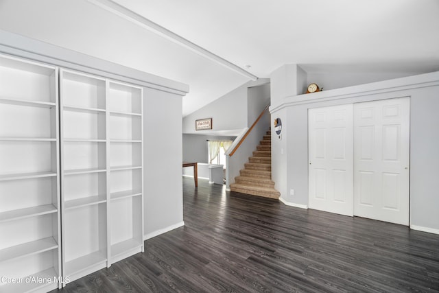 1817 N Chehalis St, Post Falls, ID 83854 - unfurnished living room featuring lofted ceiling, stairs, and dark wood-style floors