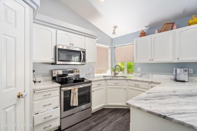 1817 N Chehalis St, Post Falls, ID 83854 - kitchen featuring stainless steel appliances, lofted ceiling, white cabinets, and dark wood finished floors