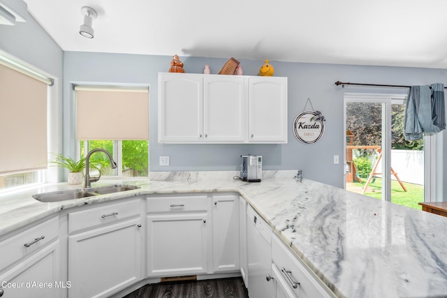1817 N Chehalis St, Post Falls, ID 83854 - kitchen with white cabinetry, light stone counters, and plenty of natural light