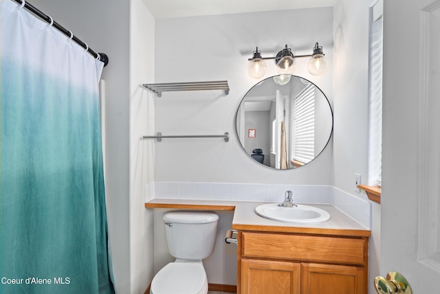 1817 N Chehalis St, Post Falls, ID 83854 - bathroom with vanity and a shower with shower curtain