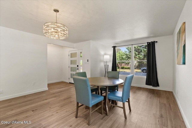 202 S 18th St, Coeur Dalene, ID 83814 - dining room featuring light wood-style flooring and a chandelier