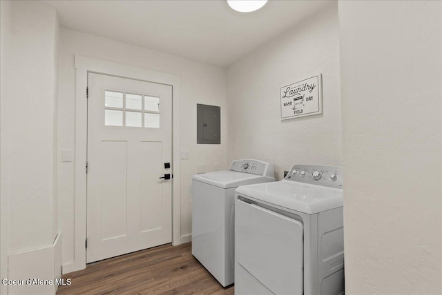 202 S 18th St, Coeur Dalene, ID 83814 - laundry room featuring washing machine and dryer, electric panel, and wood finished floors