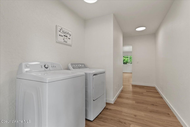 202 S 18th St, Coeur Dalene, ID 83814 - laundry room featuring washer and dryer and light wood-style flooring