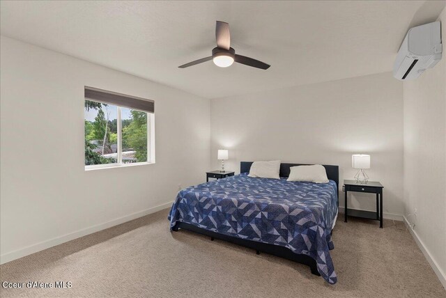 202 S 18th St, Coeur Dalene, ID 83814 - carpeted bedroom featuring a wall unit AC and a ceiling fan