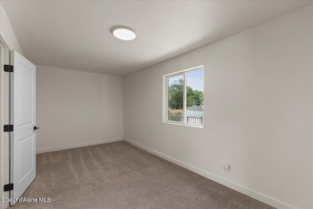 202 S 18th St, Coeur Dalene, ID 83814 - carpeted empty room with baseboards
