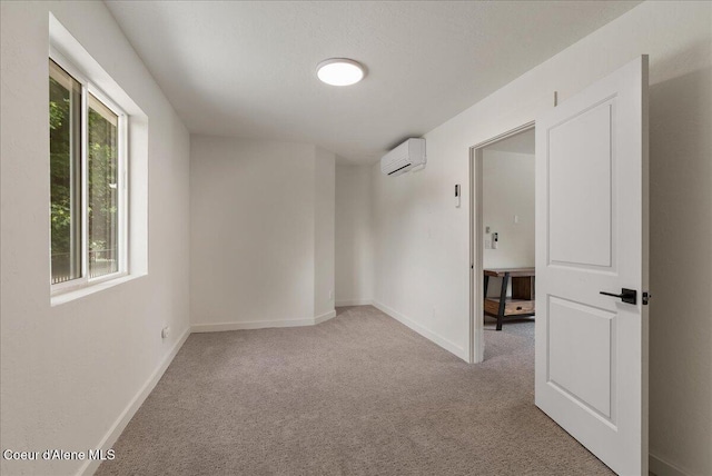 202 S 18th St, Coeur Dalene, ID 83814 - unfurnished room featuring an AC wall unit and carpet floors