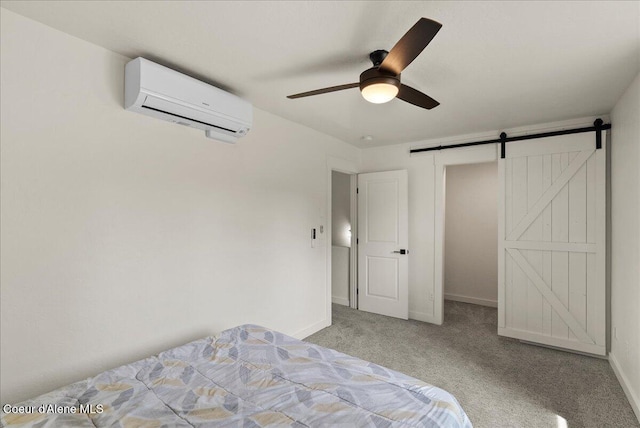 202 S 18th St, Coeur Dalene, ID 83814 - carpeted bedroom with a wall unit AC, a barn door, and a ceiling fan