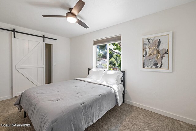 202 S 18th St, Coeur Dalene, ID 83814 - carpeted bedroom featuring a barn door and ceiling fan
