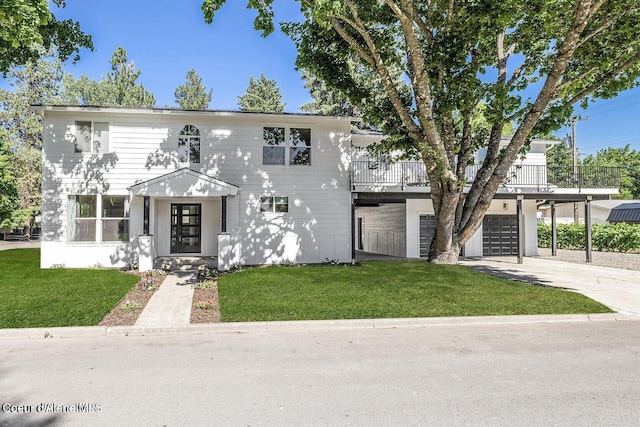202 S 18th St, Coeur Dalene, ID 83814 - view of property with an attached garage, a front yard, concrete driveway, and a balcony