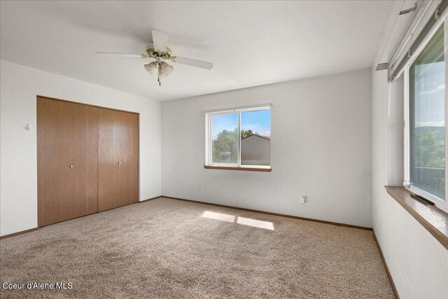 401 W 19th Ave, Post Falls, ID 83854 - unfurnished bedroom with carpet floors, a closet, and ceiling fan