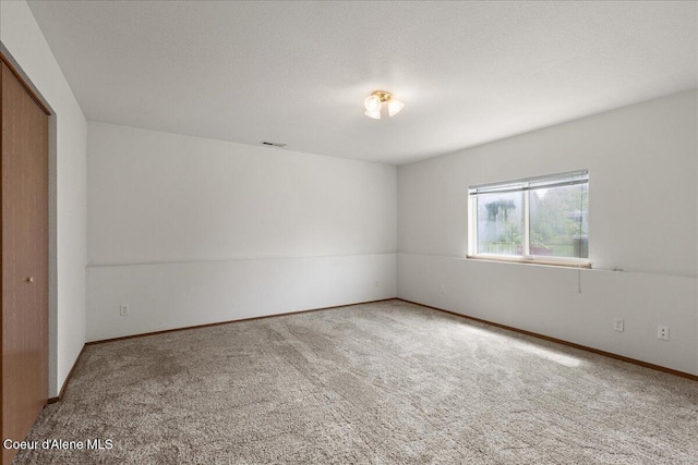 401 W 19th Ave, Post Falls, ID 83854 - carpeted empty room featuring baseboards
