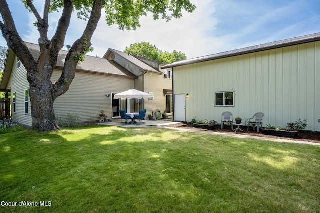 303 S 19th St, Coeur Dalene, ID 83814 - rear view of house with a yard and a patio