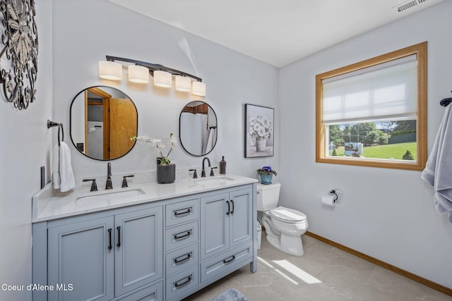 303 S 19th St, Coeur Dalene, ID 83814 - bathroom with double vanity and toilet
