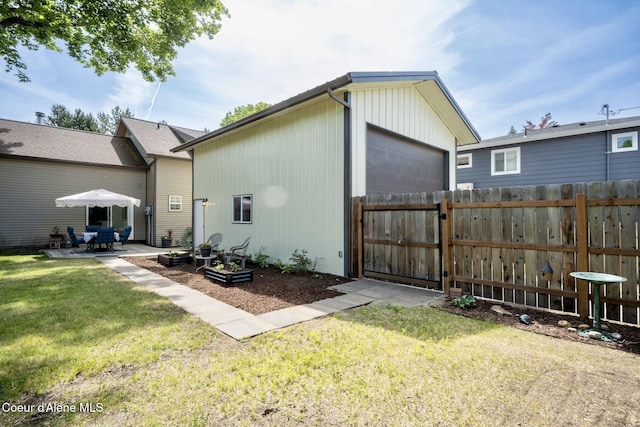 303 S 19th St, Coeur Dalene, ID 83814 - rear view of house with an outbuilding and a patio area
