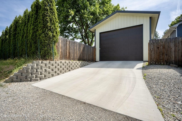 303 S 19th St, Coeur Dalene, ID 83814 - garage with concrete driveway