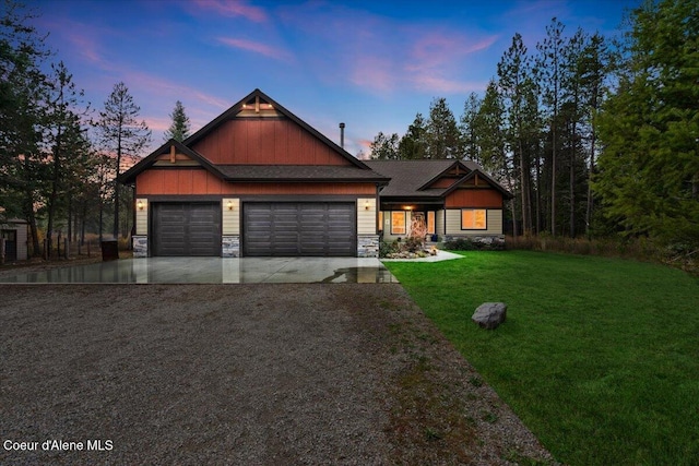 2130 E Bellamy Rd, Athol, ID 83801 - craftsman inspired home featuring driveway, stone siding, an attached garage, a yard, and board and batten siding