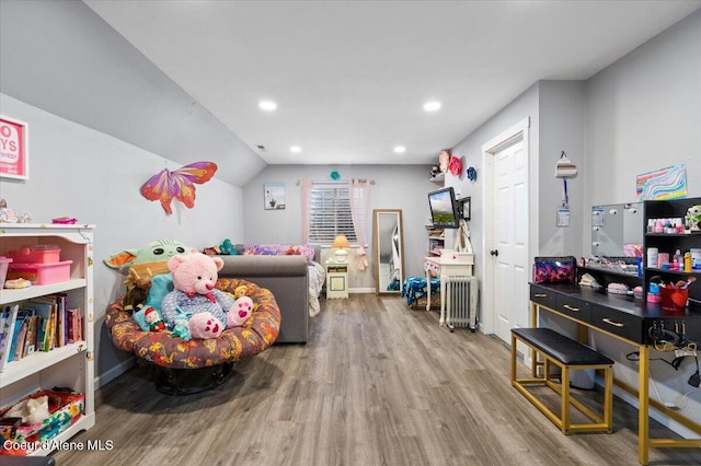 2130 E Bellamy Rd, Athol, ID 83801 - recreation room featuring wood finished floors, recessed lighting, radiator, and lofted ceiling