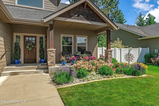 1431 W Ashmont Way, Coeur Dalene, ID 83815 - view of exterior entry featuring a shingled roof and a porch