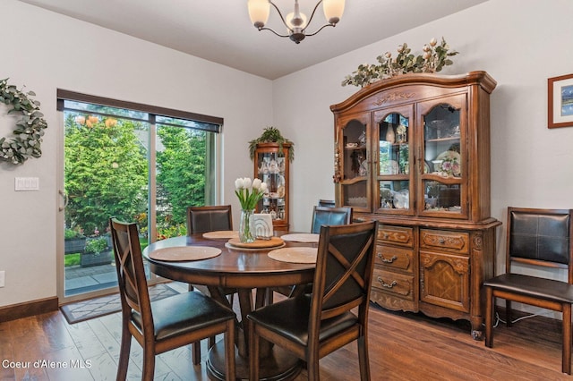 1431 W Ashmont Way, Coeur Dalene, ID 83815 - dining area featuring a chandelier and wood finished floors