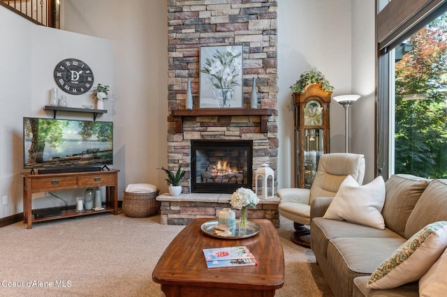 1431 W Ashmont Way, Coeur Dalene, ID 83815 - living room featuring a stone fireplace and carpet