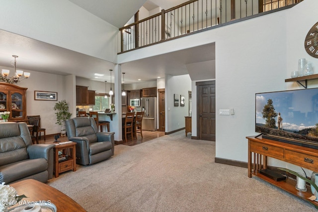 1431 W Ashmont Way, Coeur Dalene, ID 83815 - living area featuring a chandelier, light carpet, and a high ceiling
