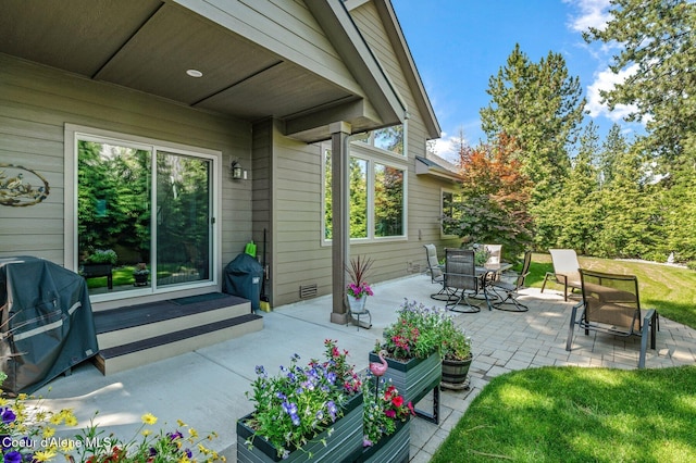 1431 W Ashmont Way, Coeur Dalene, ID 83815 - view of patio / terrace featuring area for grilling and outdoor dining space