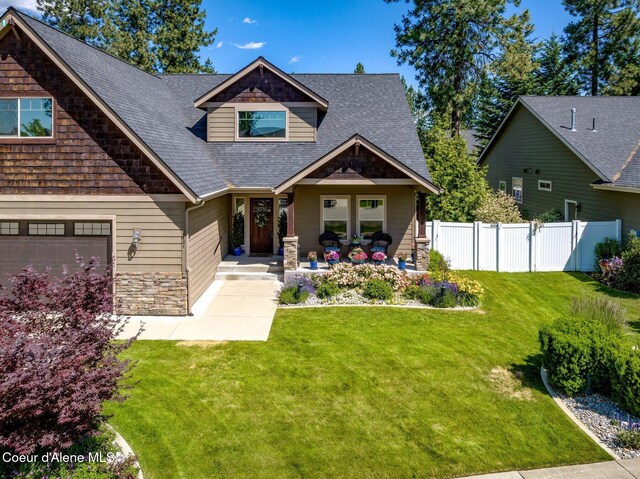 1431 W Ashmont Way, Coeur Dalene, ID 83815 - craftsman inspired home featuring a shingled roof, a porch, and stone siding