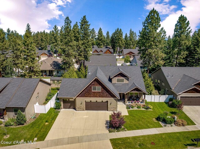 1431 W Ashmont Way, Coeur Dalene, ID 83815 - view of front of home with a residential view, stone siding, concrete driveway, and a garage