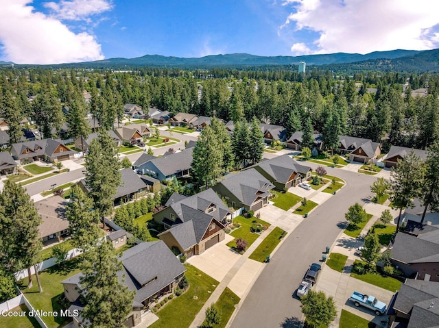 1431 W Ashmont Way, Coeur Dalene, ID 83815 - aerial view of residential area featuring a mountain backdrop and a forest