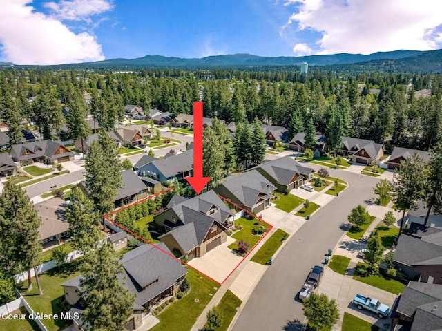 1431 W Ashmont Way, Coeur Dalene, ID 83815 - aerial view of residential area featuring a mountainous background