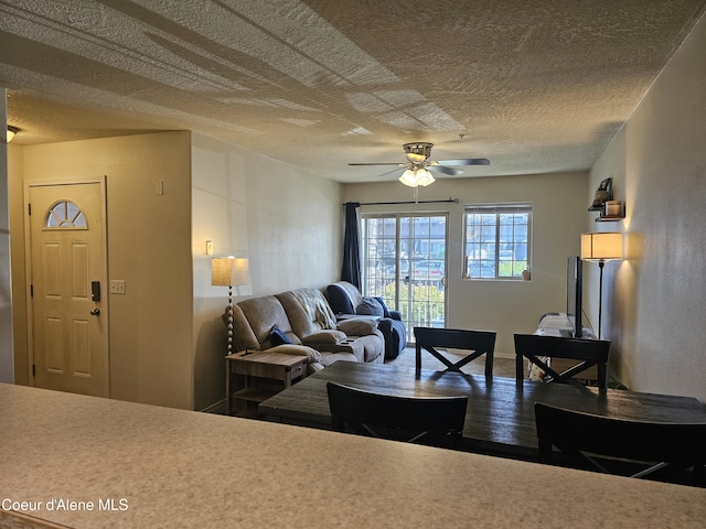848 N Chase Rd # 102, Post Falls, ID 83854 - living room featuring a ceiling fan and a textured ceiling