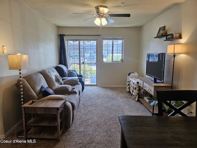 848 N Chase Rd # 102, Post Falls, ID 83854 - carpeted living area with ceiling fan and a textured ceiling