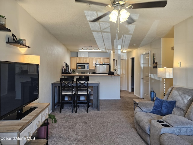 848 N Chase Rd # 102, Post Falls, ID 83854 - carpeted living area featuring a ceiling fan