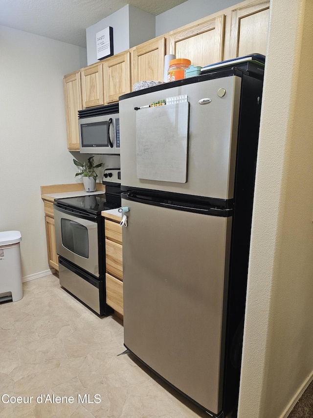 848 N Chase Rd # 102, Post Falls, ID 83854 - kitchen featuring stainless steel appliances and light brown cabinets