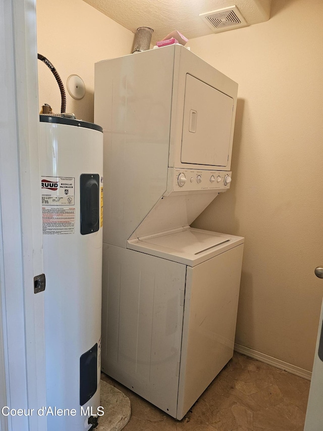 848 N Chase Rd # 102, Post Falls, ID 83854 - laundry area with electric water heater and stacked washer / dryer