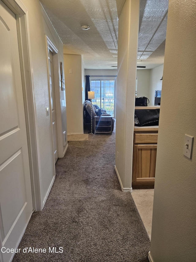 848 N Chase Rd # 102, Post Falls, ID 83854 - hall with carpet flooring and a textured ceiling